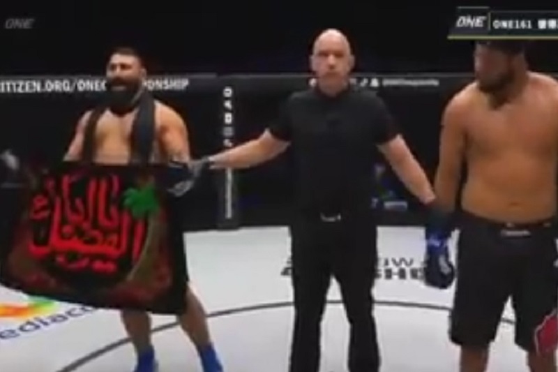 عکس| پرچم یا ابوالفضل (ع) روی دست ایرج عزیزپور قهرمان ایرانی MMA پس از پیروزی مقابل حریف برزیلی | دیلی 3